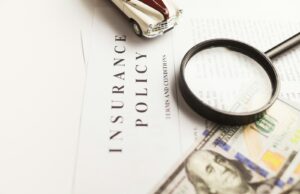 Versicherungen digital optimieren lassen a magnifying glass sitting on top of a piece of paper